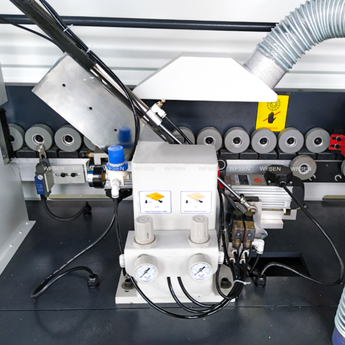 Trimming unit of an automatic edge banding machine