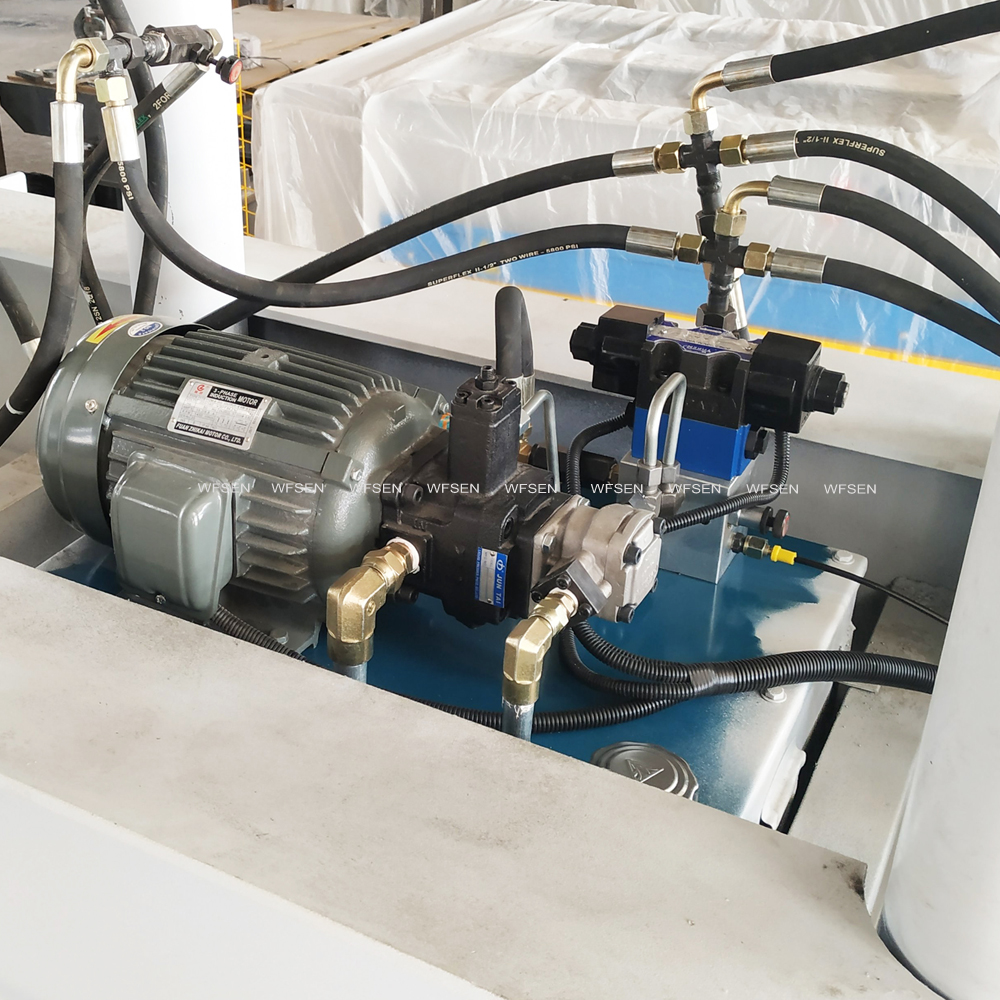 Hydraulic power unit on a WFSEN cold press machine with motor, pump, valve block and hoses