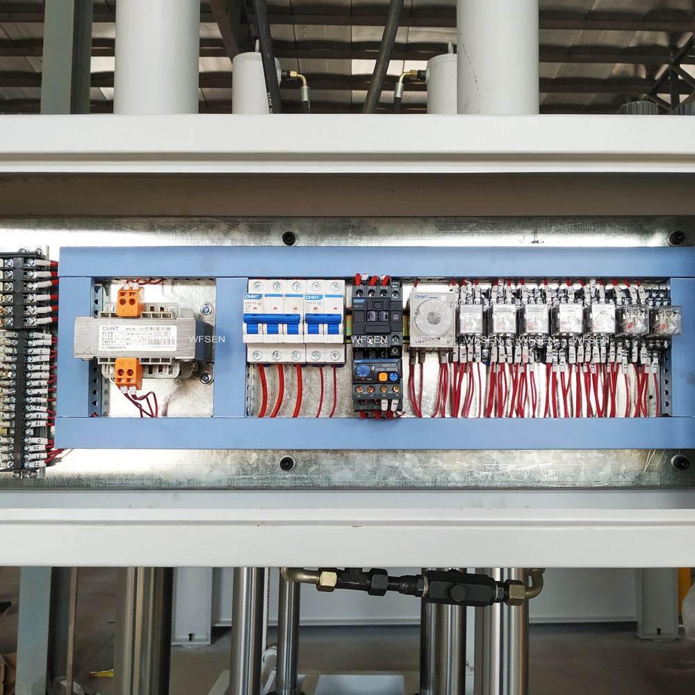 Electrical cabinet inside a WFSEN cold press machine with contactors, breakers and timer relays